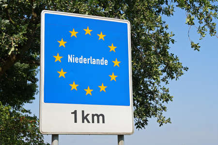 road sign netherlands 1 kmの写真素材