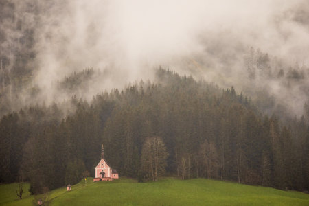 Church in the fog in the mountains.の写真素材