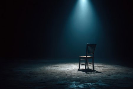 a cinematic black background with single spotlight on empty child's chair, symbolic solitude and awareness framing, Generative AIの素材