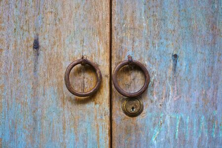 Old wood door with circle door knobの写真素材