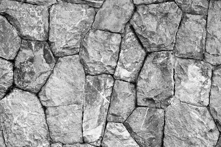 monochrome shot of stone wall texture background