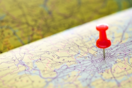 push red pin pointing on the map at London for travel backgroundの写真素材