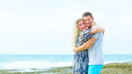 portrait of a happy couple in love on the beach at summer dayの写真素材