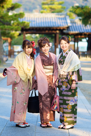 Kyoto, Japan - February 20, 2014  three young beautiful Japanese women wear a traditional dress called Kimono on February 20, 2014 at Gion, Kyoto, Japan のeditorial素材
