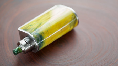 high end yellow green stabilized wood regulated box mods with rebuildable dripping atomizer on...