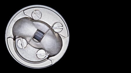 close up, macro shot, top view of single micro coil with japanese organic cotton wick in high end...