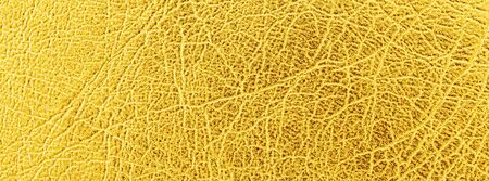 close up shot of bright gold leather texture for banner backgroundの写真素材