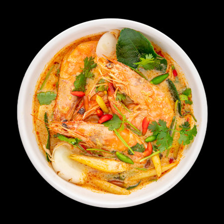 Tom Yum Goong, Tom Yum Kung, Thai food, hot and sour shrimp soup, creamy style in white ceramic bowl...