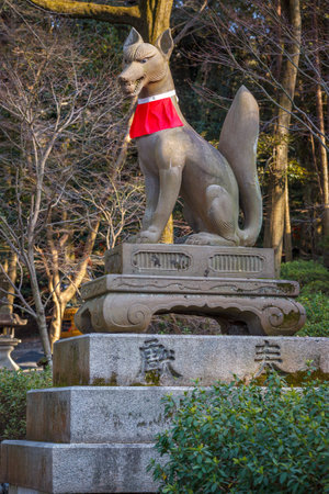 Stone Fox or Kitsune Statue at Fushimi Inari Taisha Shrine in Kyoto, Japanのeditorial素材