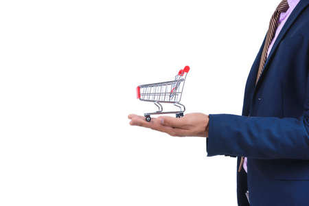 Businessman holding a red small shopping cart on white background isolated.Business concept.の写真素材
