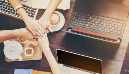 Young and modern businessmen are touching teamwork for a stable business.の写真素材