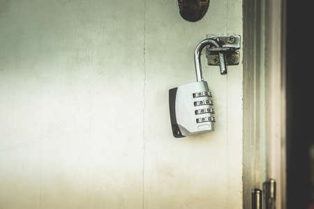 Key with door unlocking numbers with dark secrets inside.の写真素材