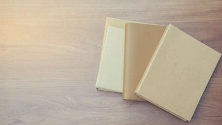 Work files, papers and notebooks on wooden floors.の写真素材