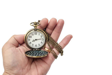 Hand of a man holding a pocket watch for a look. On a white background isolatedの写真素材