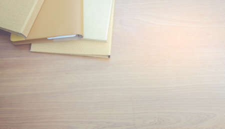 Work files, papers and notebooks on wooden floors.の写真素材
