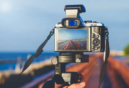 The old camera image With a picture and a pretty sky. A sun glare and blurred background.Vintage Styleの写真素材