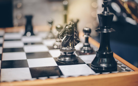Wooden chess game with chess horse and other characters in the game.Business Concept