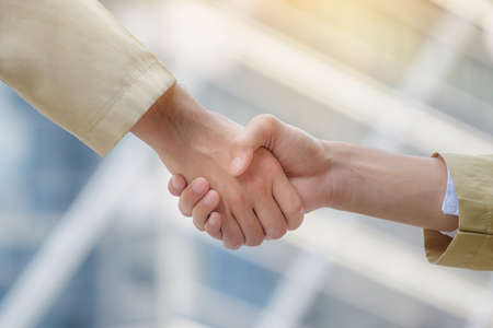Arab businessmen shake hands and accept business deals for teamwork.の写真素材