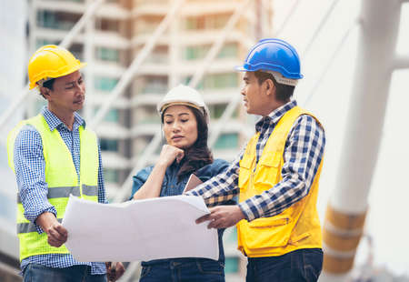 Architects and business associates consulted on the same mission oriented work plan.の写真素材