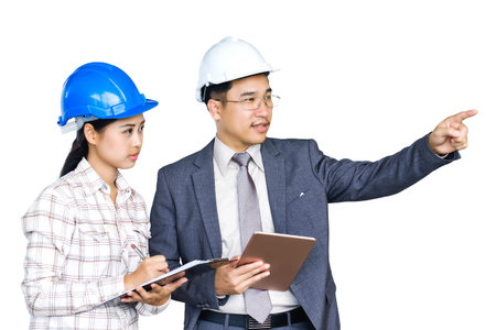Asian Male architects, female engineers are discussing their assigned work in a committed manner. on...