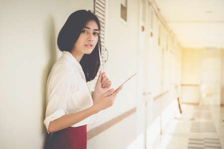 Asian women businessmen use tablet to contact work and business.の写真素材