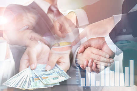 Double exposure,Businessmen are handshake agree to join the business.Business success concept.の写真素材