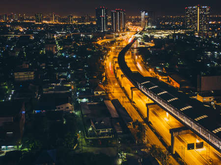 Metro station in the middle of the city at night.High angle view.Focus at the BTS station.のeditorial素材