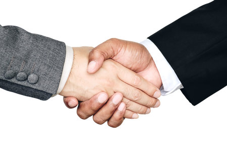 Businessmen are handshake agree to join the business.On a white background isolated.