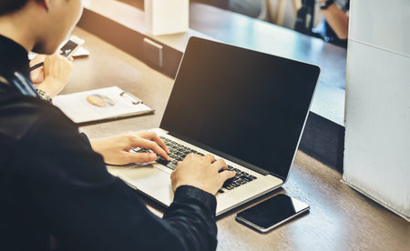 A business man is analyzing and planning a business with information available.