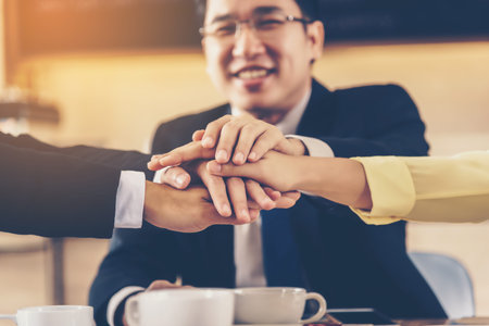 The Business Confederate hands together. The teamwork and unity is the only one completion.