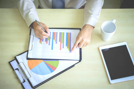 Business men meeting and included a chart in the Business Plan.