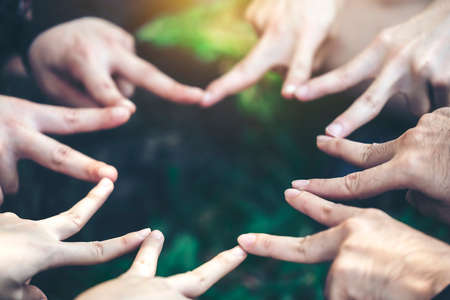 Fingers are star-shaped to represent teamwork and harmony.This image is soft focus.の写真素材