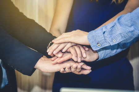 The Business Confederate hands together. The teamwork and unity is the only one completion.
