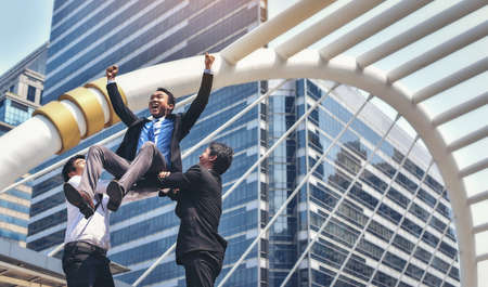 Asian male business people are happy about his success in business.の写真素材