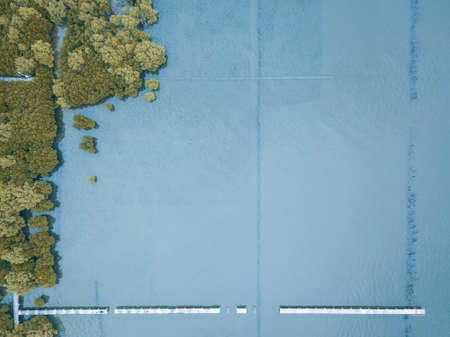 The beach with pathway around the trail and forest trees. High Angle picture.の写真素材