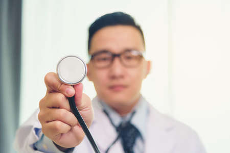 Asia Doctor is using a stethoscope to check for illness.の写真素材