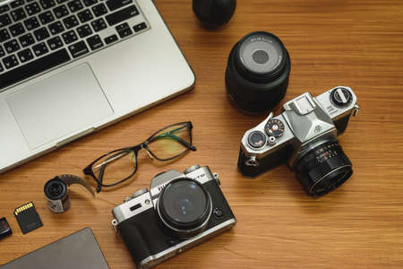 Camera, lens and photographer equipment that is ready to work on the wooden. top view.の写真素材