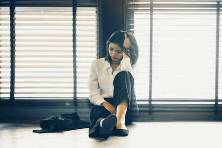 Asian office lady is stressed with an unsuccessful job.の写真素材