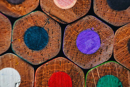 Many wooden crayons that have been used in the dark background are macro images.の写真素材