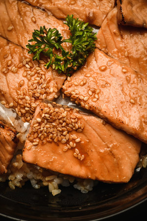 Japanese food, simmered salmon with rice and sesame seedsの写真素材
