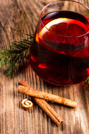 Red tea in an elegant glass on a rustic tableの写真素材