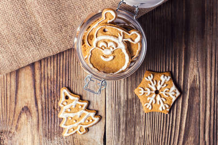 Gingerbread cookies in a jar on a wooden tableの写真素材