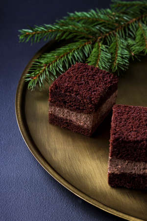 Chocolate cake on a golden plateの写真素材