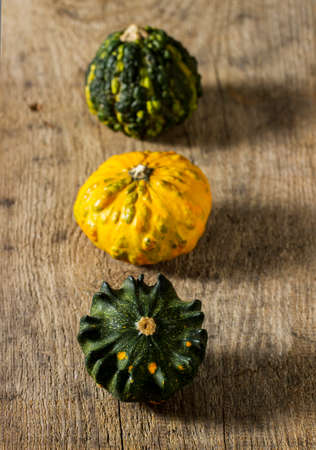 Pumpkins on a wooden tableの写真素材