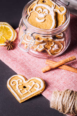 Gingerbread cookies with cinnamon, anise and lemon in a jarの写真素材