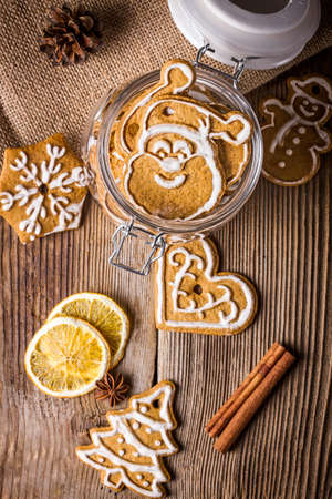 Christmas cookies with cinnamon and anise on a wooden tableの写真素材