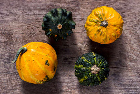 Decorative pumpkins on a wooden tableの写真素材