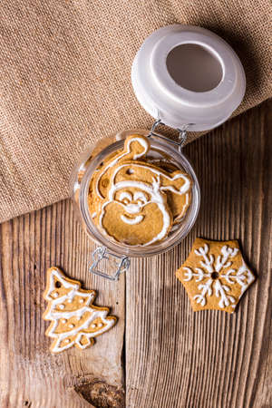 Gingerbread cookies in a jar on a wooden tableの写真素材