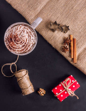 Christmas cocoa, presents, cinnamon on a dark backgroundの写真素材
