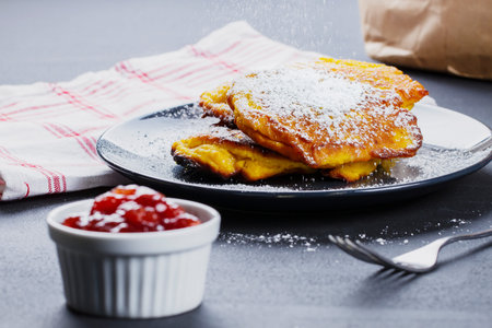 Pumpkin pancakes with marmelade and powdered sugarの写真素材